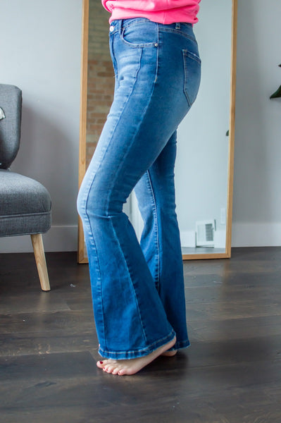 Side view of model wearing flare jeans