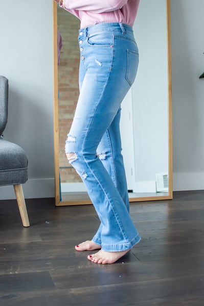 Side view of model wearing high waisted flares